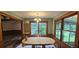 Bright dining room with large windows, wooden trim and view to living area at 4055 Haralson Mill Ne Rd, Conyers, GA 30012