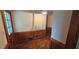 Welcoming hallway featuring wood paneling and a classic parquet floor at 4055 Haralson Mill Ne Rd, Conyers, GA 30012
