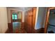 Welcoming hallway featuring wood paneling and view to bedroom at 4055 Haralson Mill Ne Rd, Conyers, GA 30012