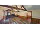Spacious living area showcasing wood trim, fireplace, vaulted ceiling and durable flooring at 4055 Haralson Mill Ne Rd, Conyers, GA 30012