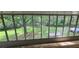 Enclosed sunroom with full backyard view through many windows, plus full backyard at 4055 Haralson Mill Ne Rd, Conyers, GA 30012