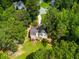 Aerial view of home featuring lush greenery surrounding, and a large deck at 169 Knights Ct, Dallas, GA 30157