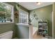 Bathroom featuring a garden tub, green walls, and natural light at 169 Knights Ct, Dallas, GA 30157