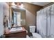 Bathroom featuring a clean, wood-trimmed sink and decorative shower curtain at 169 Knights Ct, Dallas, GA 30157