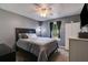 Cozy bedroom with a ceiling fan, large window, and contemporary decor at 169 Knights Ct, Dallas, GA 30157