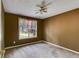 Neutral bedroom with carpet, ceiling fan and a large window at 169 Knights Ct, Dallas, GA 30157