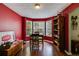 Dining room with hardwood floors and bay window seating, brightened by natural light at 169 Knights Ct, Dallas, GA 30157