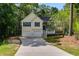 Charming two-story traditional home featuring a two-car garage and covered porch at 169 Knights Ct, Dallas, GA 30157