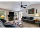 Inviting living room featuring a stone fireplace, vaulted ceiling, and large windows at 169 Knights Ct, Dallas, GA 30157