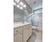 Bathroom featuring a white vanity, mirror, shower over tub with glass door at 490 Grand Teton Cir, Fayetteville, GA 30215