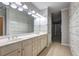 Bathroom showcasing a double sink vanity, tile flooring, and built-in storage cabinets and drawers at 490 Grand Teton Cir, Fayetteville, GA 30215