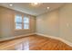 Bright bedroom featuring hardwood floors, a large window, and recessed lighting at 490 Grand Teton Cir, Fayetteville, GA 30215