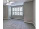 Bedroom featuring neutral walls, plush carpet, and a large window with shutters at 490 Grand Teton Cir, Fayetteville, GA 30215