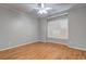 Bedroom with hardwood floors, neutral paint, and a window with shutter-style blinds at 490 Grand Teton Cir, Fayetteville, GA 30215