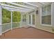 Private wooden deck with white railings, views of the trees and backyard, and access to the home at 490 Grand Teton Cir, Fayetteville, GA 30215