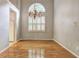 This elegant dining room features hardwood floors, a chandelier, and vaulted ceilings at 490 Grand Teton Cir, Fayetteville, GA 30215