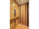 Residential elevator featuring wood paneling, an operating panel, and folding door at 490 Grand Teton Cir, Fayetteville, GA 30215