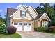 Charming home featuring a two-car garage and stone accents at 490 Grand Teton Cir, Fayetteville, GA 30215