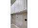 Well-equipped laundry area with ample white cabinetry and utility connections at 490 Grand Teton Cir, Fayetteville, GA 30215