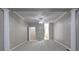 Living room featuring decorative columns, grey carpet, and a ceiling fan at 490 Grand Teton Cir, Fayetteville, GA 30215