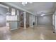 Open floor plan featuring tile flooring, a fireplace, decorative pillars and an adjacent kitchen at 490 Grand Teton Cir, Fayetteville, GA 30215