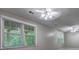 Spacious living room featuring a ceiling fan and natural light coming from the large window at 490 Grand Teton Cir, Fayetteville, GA 30215