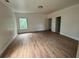 Bedroom featuring wood look flooring and natural light at 7 Charleston Se Ave, Atlanta, GA 30315