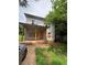 Charming two-story home with a cozy front porch and unfinished yard and boarded up windows at 7 Charleston Se Ave, Atlanta, GA 30315