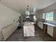 Spacious kitchen featuring new white cabinetry, a center island and modern design under construction at 7 Charleston Se Ave, Atlanta, GA 30315