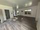 Living room under construction features wood look flooring and natural light at 7 Charleston Se Ave, Atlanta, GA 30315