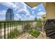 Relaxing balcony with seating and grill overlooking city and lush greenery at 799 Hammond Dr # 427, Atlanta, GA 30328