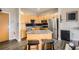 The spacious kitchen boasts stainless steel appliances, wooden cabinets, granite countertops and an island with bar stool seating at 799 Hammond Dr # 427, Atlanta, GA 30328