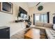 Contemporary living room with wood flooring, a mounted television, neutral couch and natural light from an outdoor view at 799 Hammond Dr # 427, Atlanta, GA 30328