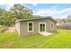 Exterior shot of backyard with a freshly painted house and new deck at 1441 Monteel Nw Dr, Atlanta, GA 30318