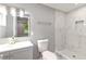 Modern bathroom featuring white marble tiled shower and gray vanity at 1441 Monteel Nw Dr, Atlanta, GA 30318