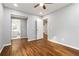 Serene bedroom featuring hardwood floors, neutral paint, and adjacent bathroom access at 1441 Monteel Nw Dr, Atlanta, GA 30318