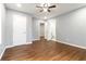 Bedroom features hardwood flooring, open doorway, and ceiling fan at 1441 Monteel Nw Dr, Atlanta, GA 30318