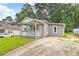 Front view of the house featuring a covered porch and driveway at 1441 Monteel Nw Dr, Atlanta, GA 30318