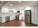 Modern kitchen featuring white cabinets, stainless steel appliances, and hardwood floors at 1441 Monteel Nw Dr, Atlanta, GA 30318