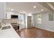 Updated kitchen featuring white cabinets, stainless steel appliances, and laminate floors at 1441 Monteel Nw Dr, Atlanta, GA 30318