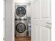 Convenient laundry area with modern stackable washer and dryer set at 1441 Monteel Nw Dr, Atlanta, GA 30318