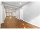 Bright living area with hardwood floors, neutral paint, and access to other rooms at 1441 Monteel Nw Dr, Atlanta, GA 30318