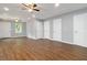 Spacious living room with hardwood floors, recessed lighting, and multiple access doors at 1441 Monteel Nw Dr, Atlanta, GA 30318