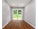 Bright room featuring hardwood floors and sliding glass door at 1441 Monteel Nw Dr, Atlanta, GA 30318