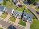 Aerial view showcasing homes with well-maintained lawns, mature trees, and neighborhood streets on a sunny day at 137 Hidden Lake Cir, Canton, GA 30114