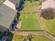 Spacious fenced backyard with patio, fire pit, and a grassy area perfect for outdoor entertaining and recreation at 137 Hidden Lake Cir, Canton, GA 30114