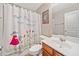 Bathroom with patterned shower curtain, white vanity, and toilet at 137 Hidden Lake Cir, Canton, GA 30114