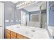 Bright bathroom featuring double sinks and a large mirror at 137 Hidden Lake Cir, Canton, GA 30114