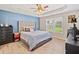 Comfortable bedroom with tray ceilings, a large bed, and a view of the outdoors at 137 Hidden Lake Cir, Canton, GA 30114