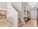 Stairway leads to the entryway; kitchen has hardwood floors and stainless steel appliances at 137 Hidden Lake Cir, Canton, GA 30114